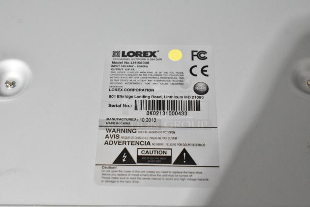Lorex LH156000 DVR label with serial number DK02131000433. Warning: Shock hazard. Model made in China, 10/2013.