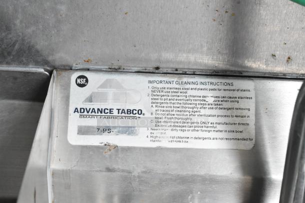 Food trailer featuring Advance Tabco sink, model 7-PS, NSF certified. Includes cleaning instructions for maintenance.