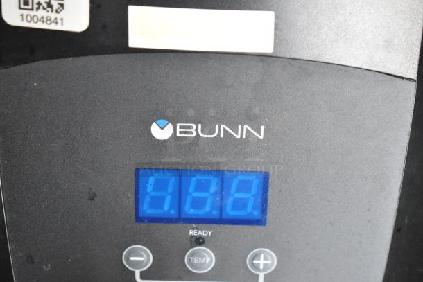 Bunn coffee machine display with temperature controls, showing "000" on blue LED screen, part of a fully outfitted food trailer.