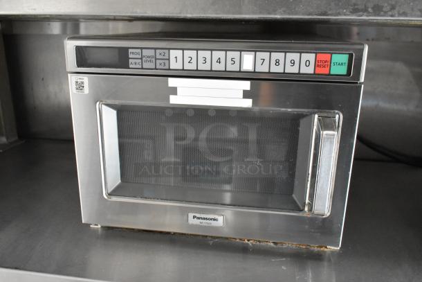 Panasonic NE-17523 commercial microwave in stainless steel, featuring numbered buttons and a start/reset panel, in good condition.