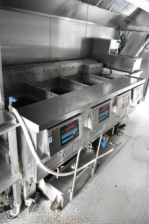 Fully outfitted food trailer interior with stainless steel appliances, digital controls, and fixtures. Ideal for opening day.