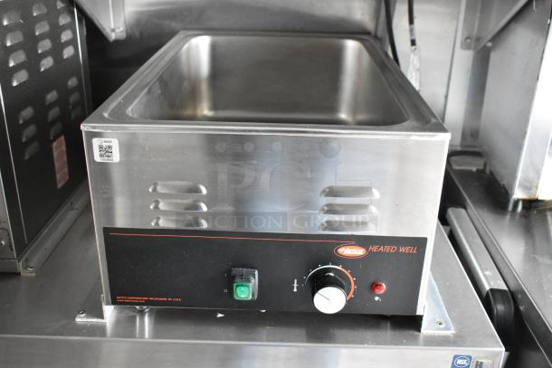 Heated well with stainless steel finish, dial control, and indicator lights. Features Hatco branding and NSF certification.