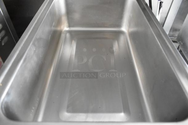 Stainless steel food warmer tray in good condition, part of fully outfitted food trailer. Perfect for commercial use.