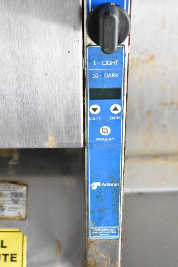 Antunes appliance control panel with light/dark settings, used condition, found in a fully outfitted food trailer.