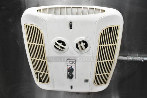 Ventilation fan inside the food trailer, featuring dual vents and control dials, showing signs of use and wear.