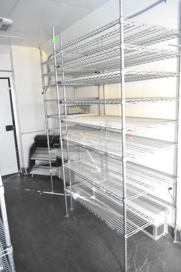 SDG Trailers storage trailer interior with metal wire shelving, clean condition, suitable for appliances or fixtures.