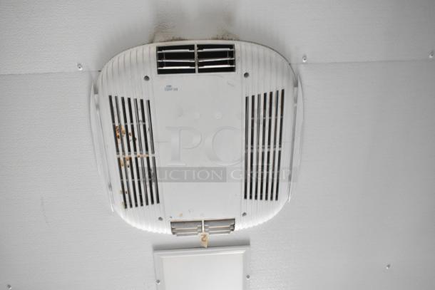 Ceiling-mounted air vent in SDG Trailers trailer, white with signs of rust and wear, model label intact.