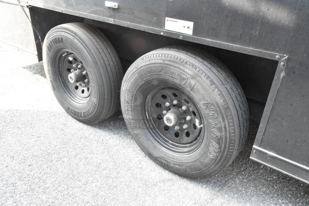 SDG Trailers trailer wheels, dual axle setup, black rims, visible Navitrac tire branding, condition good.