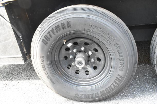 SDG Trailers wheel with DUTYMAX ST235/80R16 all-steel radial tire in good condition, detailed sidewall markings.