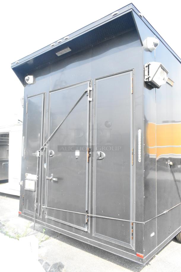 Black SDG Trailers trailer, secure doors, exterior lighting, sturdy construction, minimal wear, ideal for transport needs.