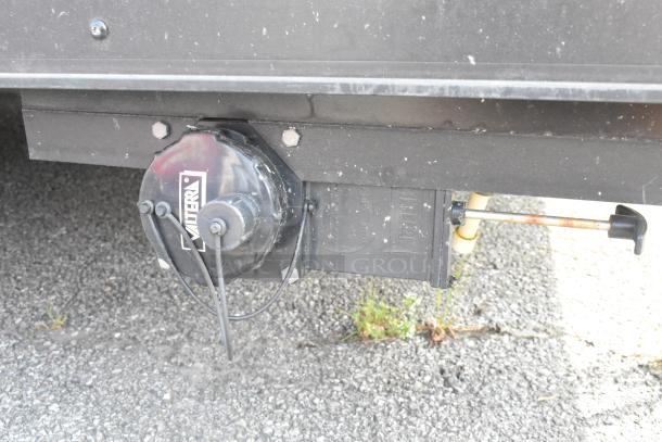 SDG Trailers component with Valterra label, showing underbody detail; pipes and wiring visible. Condition shows wear.