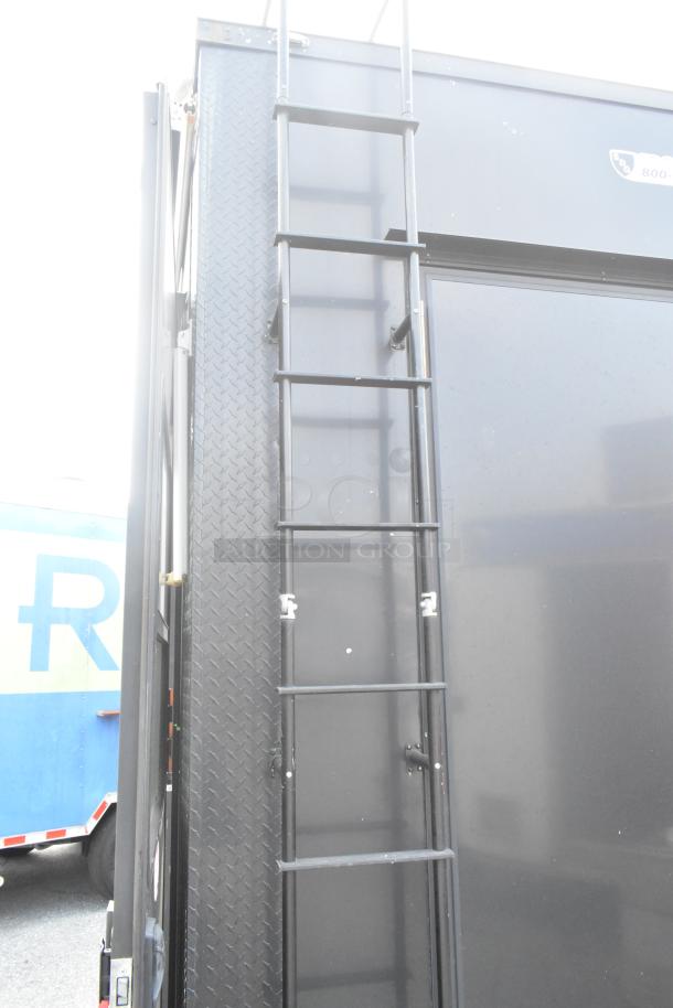 SDG Trailers trailer with black ladder and metal diamond-patterned siding, in good condition.