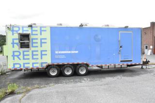 Fully outfitted Reef food trailer with branded exterior, ready for operation. Features listed in description.