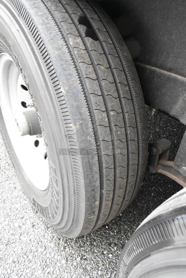 Close-up of the reef food trailer's tires, showing tread pattern and rubber condition, essential for ensuring mobility and safety.