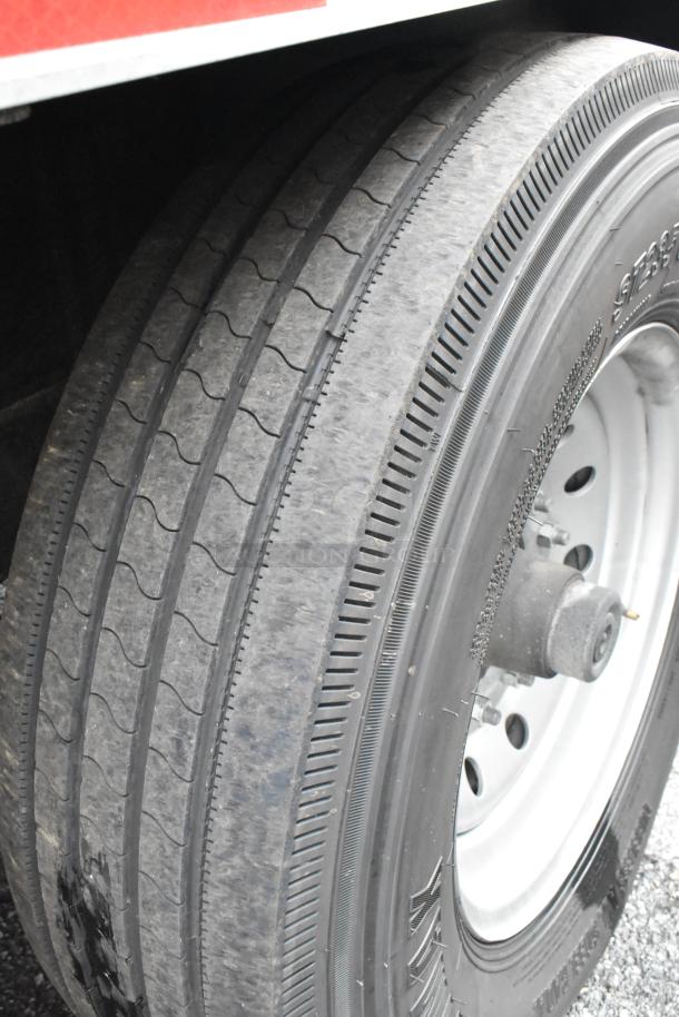 Close-up image of a tire on a Reef food trailer, showcasing tread pattern and wheel hub, indicating good condition.