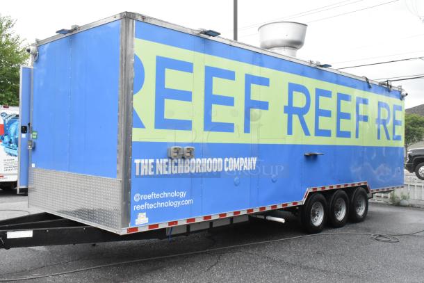 Blue Reef food trailer, fully outfitted and ready for use, features stainless steel fixtures and equipment. Brand logos visible.
