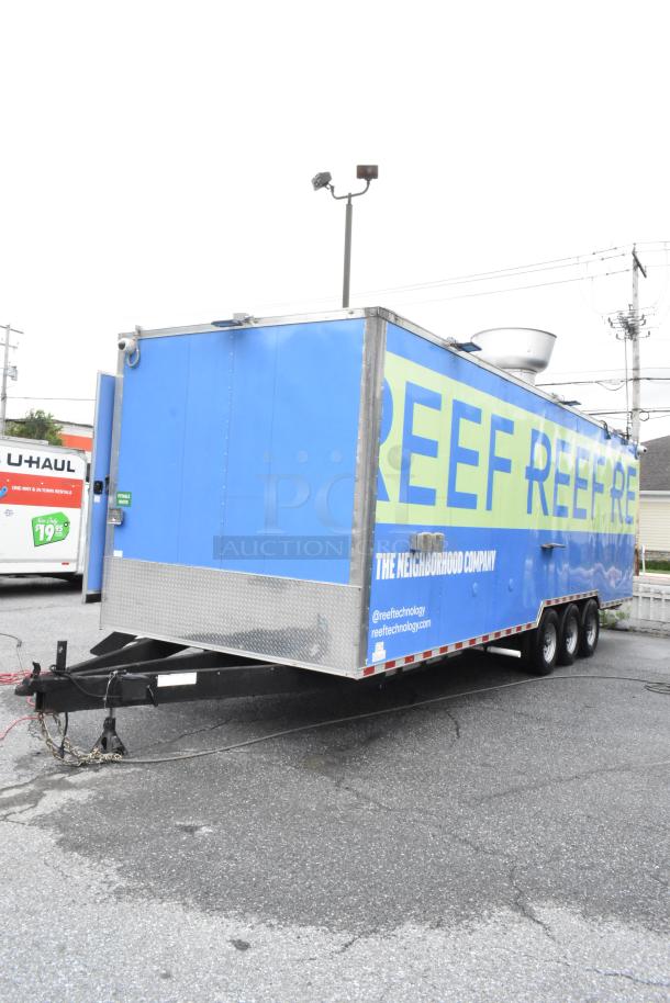 Fully outfitted Reef food trailer in blue, ready for operation. Features logos and details for reeftechnology.com.