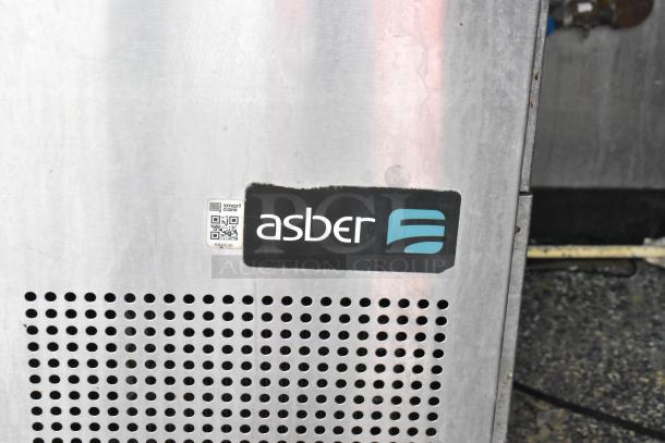 Asber appliance in a food trailer, showing "smart care" QR code and branding. Durable metal finish and ventilation detail.