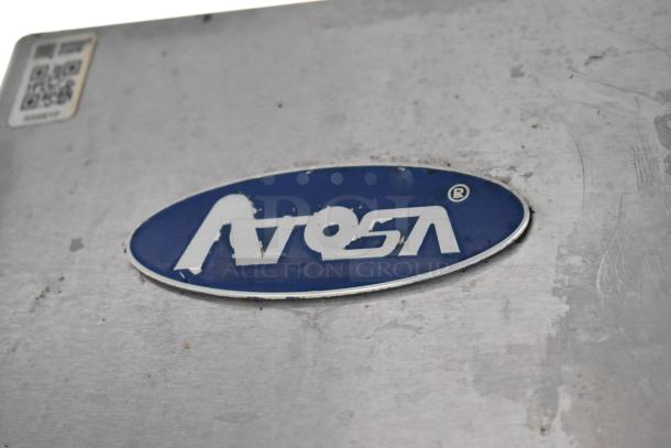 Atosa logo on a stainless steel surface of a food trailer appliance. QR code sticker visible.