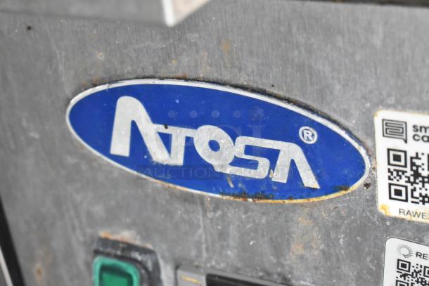 Notosa equipment logo on a food trailer. Features visible QR code labels. Condition shows signs of wear.