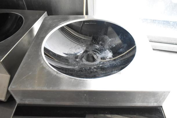 Stainless steel commercial induction cooktop with black ceramic surface in a food trailer. Marked with "ITCSmp Technology."