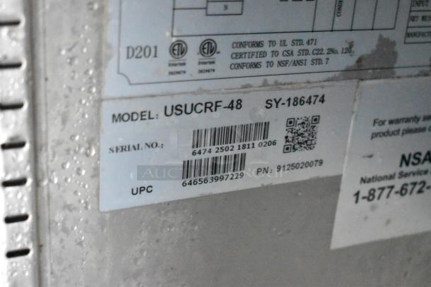 Food trailer appliance label, Model: USUCRF-48, Serial: 6474 2502 1811 0206, UPC: 646563997229, wet surface.