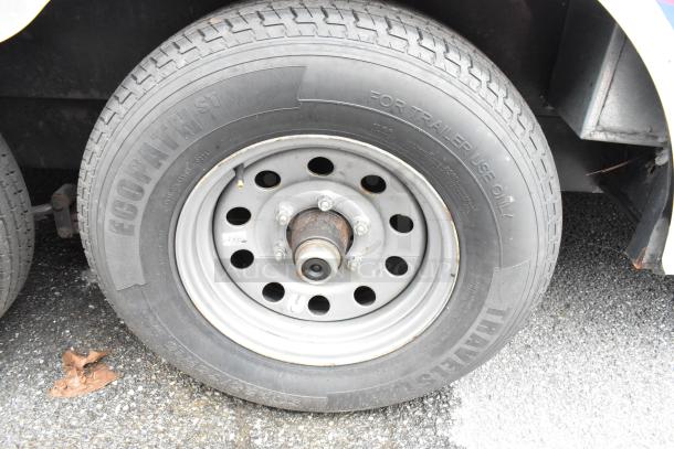 Close-up of a trailer tire with an Ecopath ST tire, marked "For Trailer Use Only." The tire tread appears in good condition.