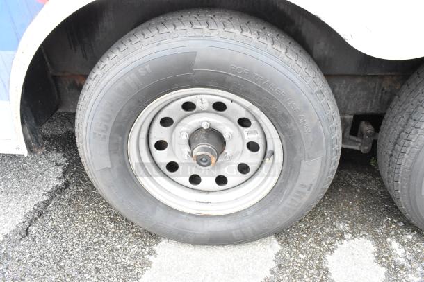 Trailer wheel with Ecopath ST tire, marked "For Trailer Use Only." Visible rust on wheel hub, surface wear on tire.