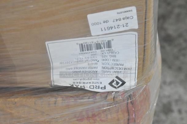 20 boxes of 200 Pro Pak white paper handle bags, new with scratch and dent. Visible shipping labels and barcodes.