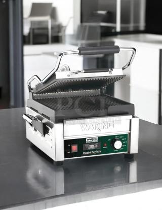 Waring WPG-150 Panini Grill in excellent condition, stainless steel, tested and working, 120V, temperature control knob.