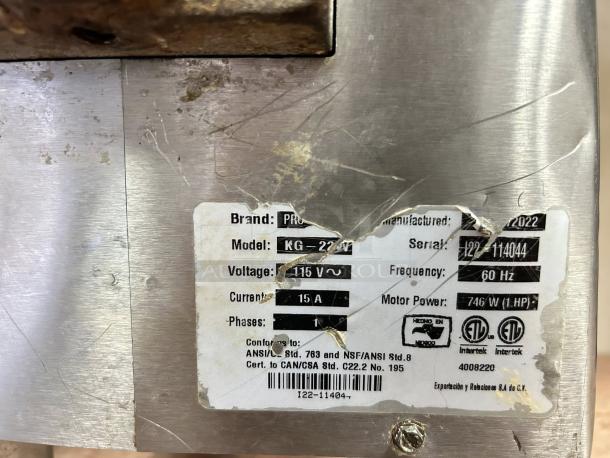 Hudson Procut KG-22-W Electric Meat Grinder, stainless steel, 115V, 1 HP, serial 122-114044, label shows tech specs.