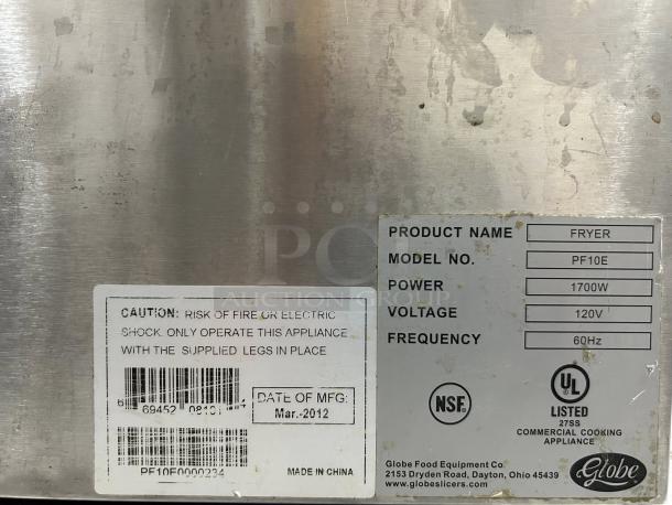 Globe PF-10E electric countertop fryer label showing model, power (1700W), voltage (120V), and manufacturing date (Mar. 2012).
