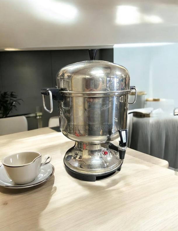 Farberware Model L-1360 stainless electric percolator urn, 36 cups, tested and working, with handles.