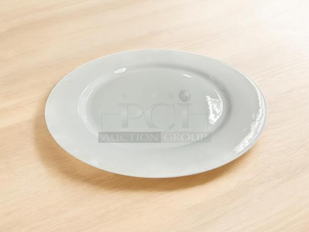 16" white dining plate, like new, made in China. Smooth surface, no visible marks or chips.