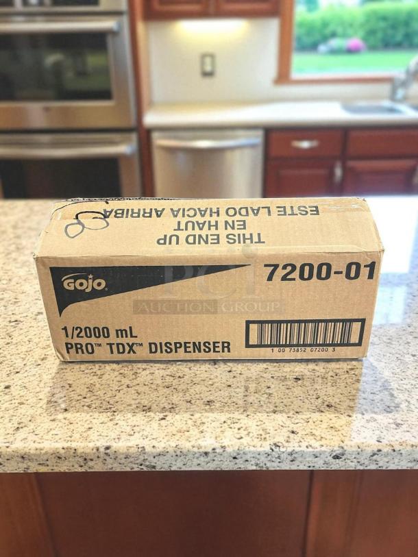 Brand New GoJo PRO™ TDX™ 5-3/4" black plastic wall mount foam hand soap dispenser in original packaging.