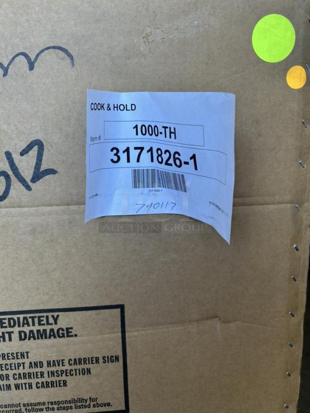 Brand new Alto-Shaam 1000-TH/I-QS full-size Halo Heat® oven in box, model 1000-TH/I-QS, with shipping labels visible.