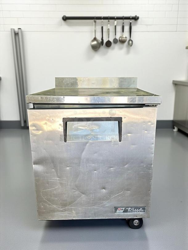 True TWT-27F Work Top Freezer; stainless steel, amazing condition, fully tested, visible label, on casters.