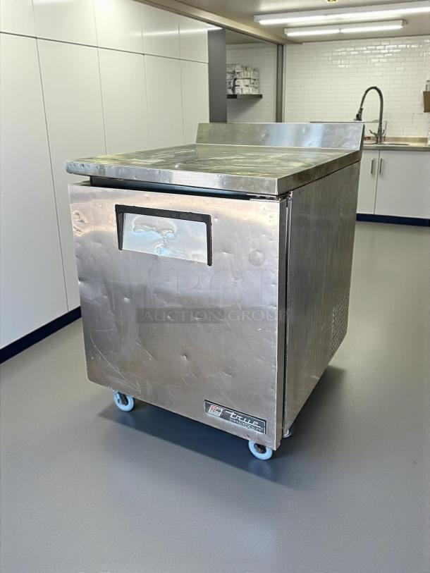 True TWT-27F work top freezer, stainless steel, amazing condition, fully tested, working, on casters, visible True label.