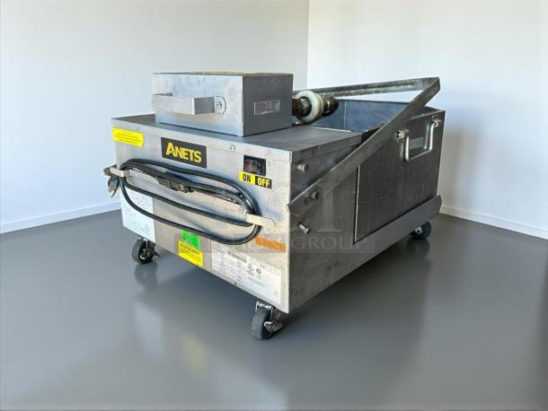 ANETS FFM80 commercial fryer filter, 80 lb capacity, gravity-fed, excellent condition. Visible on/off switch, tested and working.