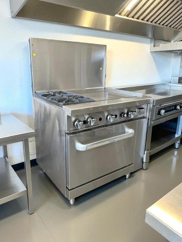 Atosa AGR-2B24GR gas range with 2 burners, 24" griddle, and oven. Stainless steel, excellent condition, fully tested.