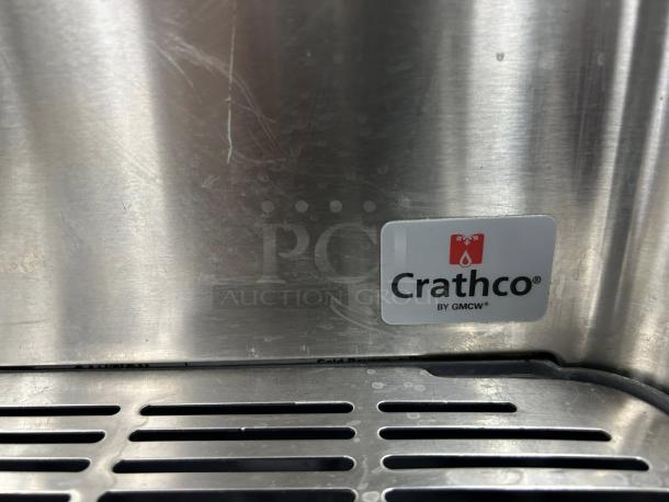 Crathco CS-4E-16-290 drink dispenser logo, stainless steel finish, indicating make and model.