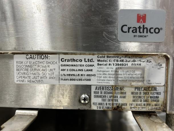 Crathco CS-4E-16-290 refrigerated drink dispenser nameplate, showing model, serial number, and safety warnings.