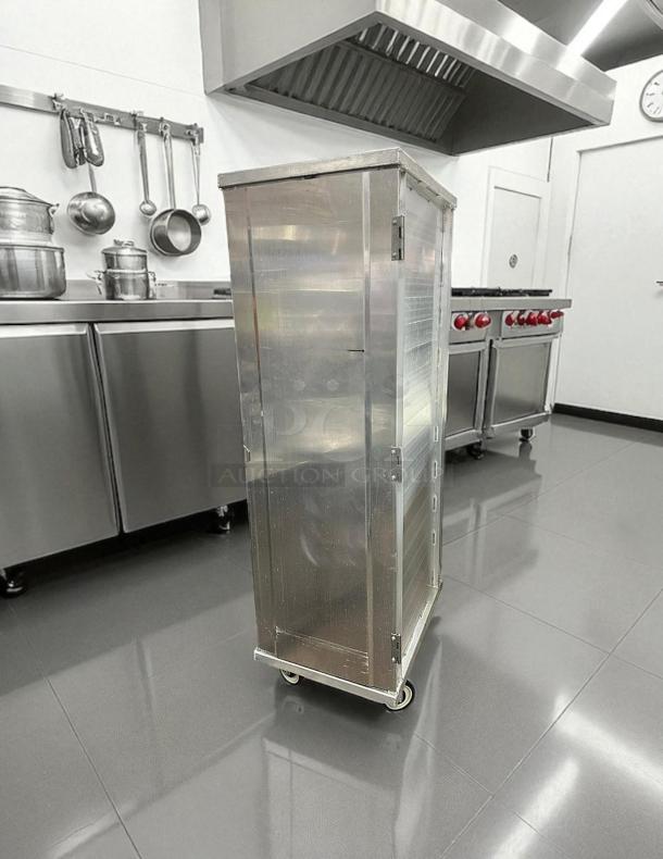 New Age Industrial 1290PH full-size enclosed bun pan rack, excellent condition, holds 40 pans, on wheels, in a commercial kitchen.
