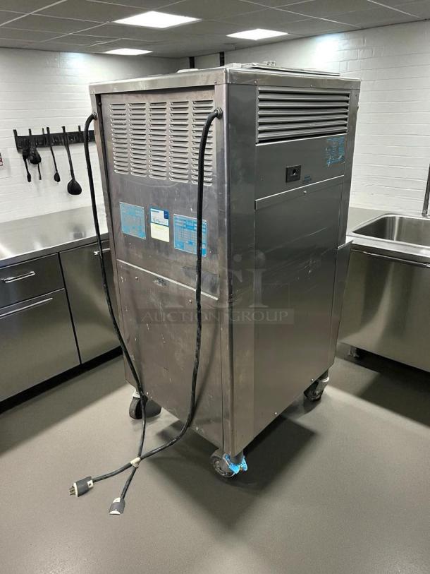 Taylor Y339-27 Gravity Ice Cream Machine, excellent condition, 208/230 V, 1 phase, fully tested, visible labels and cords, on casters.