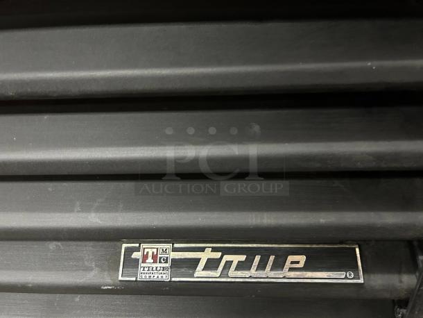 True GDM-69 black refrigerated merchandiser, 78 1/8", super nice condition, fully tested, visible True manufacturer label.