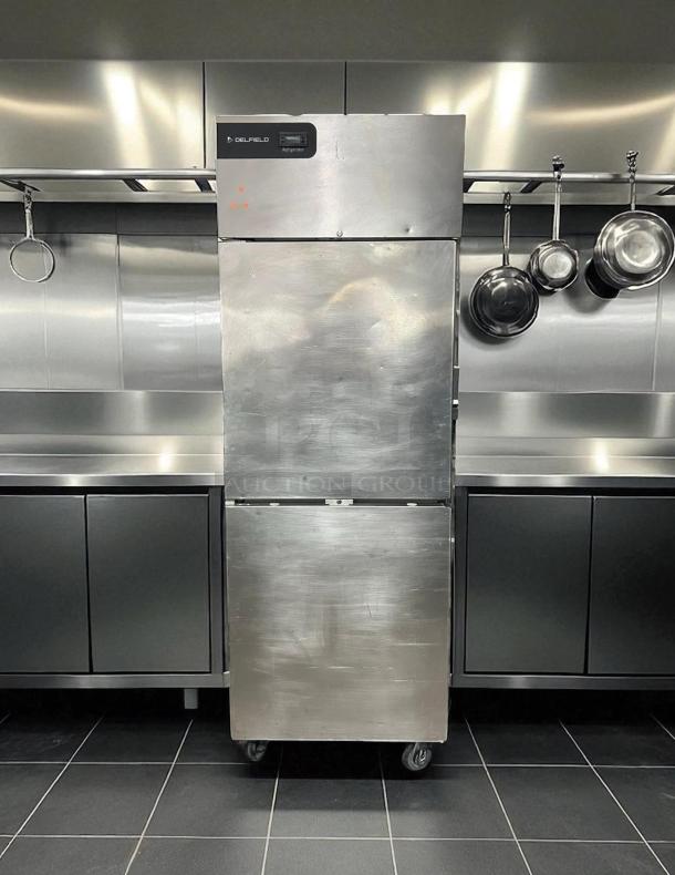 Delfield GBR1P-SH 27" refrigerator, excellent condition, two right-hinge doors, stainless steel, on casters, fully tested.
