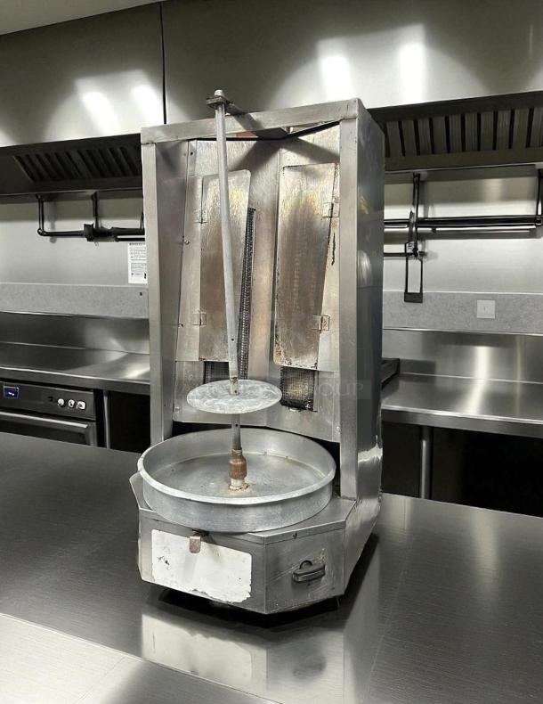 Autodoner 3-PG gas vertical broiler and rotisserie, excellent condition, 65 lb. capacity, fully tested, 120v, stainless steel.