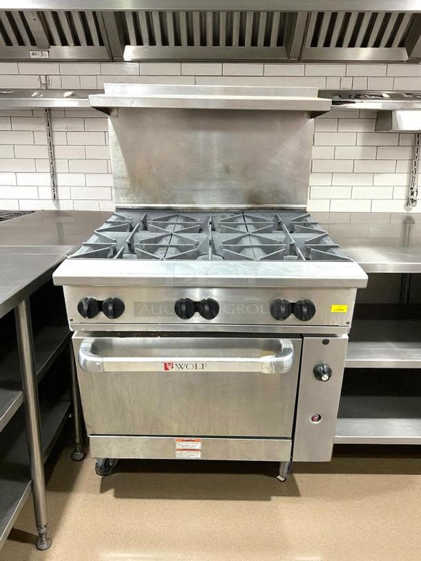 Wolf Commercial WX36-6B Range, 36" gas, 6 burners, stainless steel, tested, excellent condition, visible logo and controls.