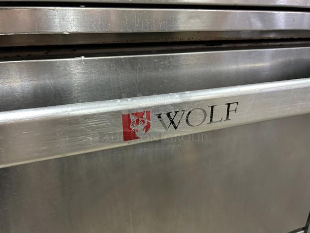 Wolf Commercial WX36-6B gas range with 6 burners, stainless steel, excellent condition, tested and working. Logo visible.