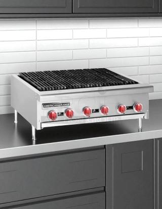 New in box American Range AERB-36 gas charbroiler, 36" wide with 6 burners, stainless steel finish, red knobs.